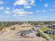 Aerial view of a mid-century modern home with a large yard and mountain views at 9449 S 156Th Pl, Gilbert, AZ 85234