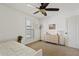 Bright bedroom with a dresser and window shutters at 9449 S 156Th Pl, Gilbert, AZ 85234