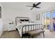 Spacious bedroom with metal bed frame and backyard access at 9449 S 156Th Pl, Gilbert, AZ 85234