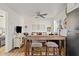 Casual dining space with rustic wooden table and seating for two at 9449 S 156Th Pl, Gilbert, AZ 85234