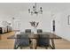 Modern dining room featuring a stylish chandelier and wood table at 9449 S 156Th Pl, Gilbert, AZ 85234