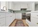 Stylish kitchen with a built-in oven and white cabinets at 9449 S 156Th Pl, Gilbert, AZ 85234