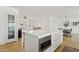 Open kitchen island with white quartz countertops and built-in microwave at 9449 S 156Th Pl, Gilbert, AZ 85234