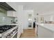 Bright kitchen with stainless steel range and white cabinetry at 9449 S 156Th Pl, Gilbert, AZ 85234