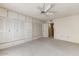 Bright bedroom with large closet and ceiling fan at 9506 W Greenhurst Dr, Sun City, AZ 85351