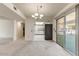 Dining area with kitchen access and view of patio at 9506 W Greenhurst Dr, Sun City, AZ 85351