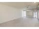 Main bedroom with carpet, ceiling fan, and sliding glass doors at 9506 W Greenhurst Dr, Sun City, AZ 85351