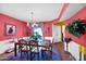 Spacious dining room with pink walls and a chandelier at 9533 W Cedar Hill N Cir, Sun City, AZ 85351