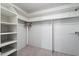 Large walk-in closet with shelving and hanging rods at 1000 Leisure World --, Mesa, AZ 85206