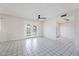 Living room with tile flooring, ceiling fan, and views to the backyard at 1000 Leisure World --, Mesa, AZ 85206