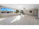 Covered patio with tile flooring, arched openings, and views of the neighborhood at 1000 Leisure World --, Mesa, AZ 85206