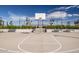 Outdoor basketball court with benches and a hoop at 1006 W Superstition Ct, Queen Creek, AZ 85140