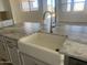 Farmhouse sink with modern faucet and granite countertop at 1006 W Superstition Ct, Queen Creek, AZ 85140