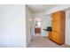 View of bathroom from bedroom with vanity and wood cabinets at 10114 W Campana Dr, Sun City, AZ 85351