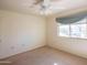 Spacious bedroom with neutral walls, carpeting, and a ceiling fan at 10114 W Campana Dr, Sun City, AZ 85351