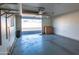 Spacious garage with extra storage shelving at 10114 W Campana Dr, Sun City, AZ 85351