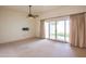 Living room with sliding glass doors leading to a patio at 10114 W Campana Dr, Sun City, AZ 85351