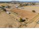 Aerial view showing large equestrian property with a main house and arena at 10137 N White Rd, Maricopa, AZ 85139