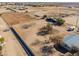 Aerial view of a house with large lot and horse stables at 10137 N White Rd, Maricopa, AZ 85139