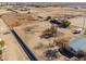 Aerial view showing expansive property with horse pens at 10137 N White Rd, Maricopa, AZ 85139