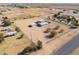 Aerial view of a single-story house on a large lot with RV parking at 10137 N White Rd, Maricopa, AZ 85139