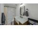 Clean bathroom, featuring a farmhouse sink and large mirror at 10137 N White Rd, Maricopa, AZ 85139