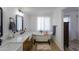 Spa-like bathroom with soaking tub and double vanity at 10137 N White Rd, Maricopa, AZ 85139