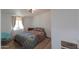 Cozy bedroom with a patterned bedspread and window at 10137 N White Rd, Maricopa, AZ 85139