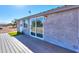 Modern home exterior with a deck and sliding glass doors at 10137 N White Rd, Maricopa, AZ 85139