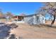 Single story home with covered patio and stucco exterior at 10137 N White Rd, Maricopa, AZ 85139