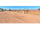 Spacious horse corral with metal fencing and water troughs at 10137 N White Rd, Maricopa, AZ 85139