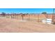 Additional view of a horse corral with metal fencing and a dirt ground at 10137 N White Rd, Maricopa, AZ 85139