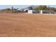 Large horse pasture with several horses and metal fencing at 10137 N White Rd, Maricopa, AZ 85139