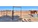 Individual horse stable with metal fencing, dirt ground, and a horse inside at 10137 N White Rd, Maricopa, AZ 85139