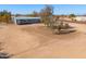 Single-story home with deck and surrounding desert landscape at 10137 N White Rd, Maricopa, AZ 85139