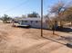 Single-story home with deck and basketball hoop at 10137 N White Rd, Maricopa, AZ 85139