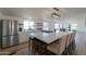 Modern kitchen island with white quartz countertops and stainless steel appliances at 10137 N White Rd, Maricopa, AZ 85139