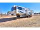 Large fifth-wheel RV parked on a gravel lot at 10137 N White Rd, Maricopa, AZ 85139