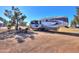 Fifth-wheel RV with outdoor seating area at 10137 N White Rd, Maricopa, AZ 85139