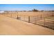 Large riding arena with metal fencing and a dirt surface at 10137 N White Rd, Maricopa, AZ 85139