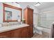 Main bathroom with a large vanity and shower/tub combo at 10606 E Hercules Dr, Sun Lakes, AZ 85248