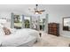 Bright bedroom with a view and ceiling fan at 10606 E Hercules Dr, Sun Lakes, AZ 85248