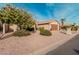 Tan house with brown garage door and desert landscaping at 10606 E Hercules Dr, Sun Lakes, AZ 85248