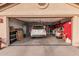 Attached garage with space for one car and storage at 10606 E Hercules Dr, Sun Lakes, AZ 85248