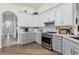 Modern kitchen with stainless steel appliances and gray cabinets at 10606 E Hercules Dr, Sun Lakes, AZ 85248