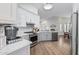 Modern kitchen with gray cabinets and white countertops at 10606 E Hercules Dr, Sun Lakes, AZ 85248