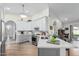 Updated kitchen featuring white and gray cabinets and a large island at 10606 E Hercules Dr, Sun Lakes, AZ 85248