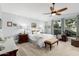 Spacious main bedroom with large windows and ceiling fan at 10606 E Hercules Dr, Sun Lakes, AZ 85248