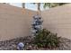 Lovely backyard water feature with stone accents at 10606 E Hercules Dr, Sun Lakes, AZ 85248