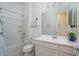 Clean bathroom with white vanity, bathtub, and shower at 10950 N 184Th Dr, Surprise, AZ 85388